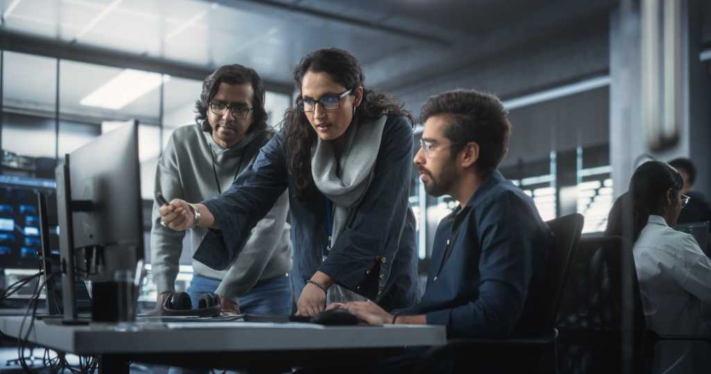 woman and 2 men computer